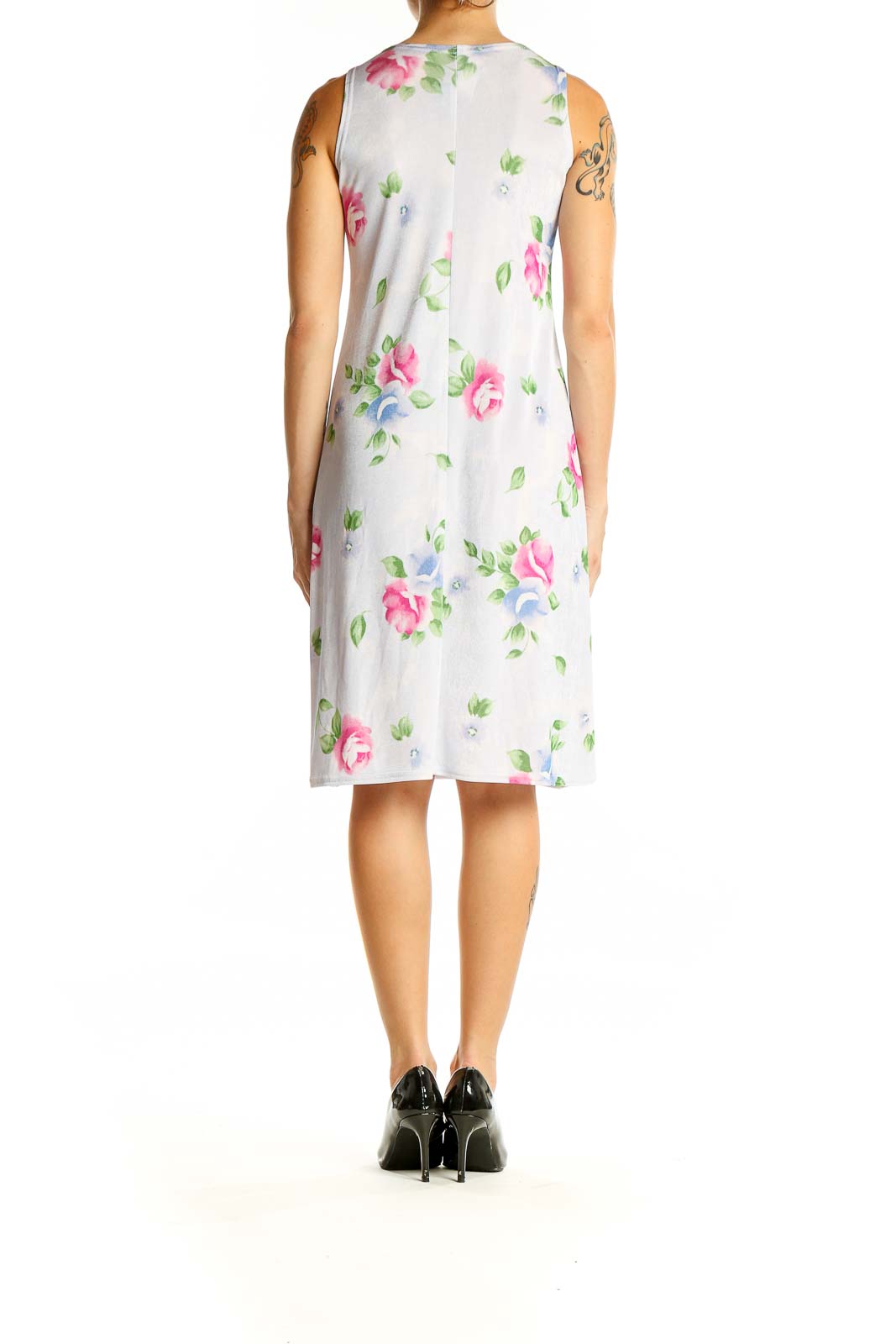 Back view of white sleeveless midi dress with scattered floral pattern