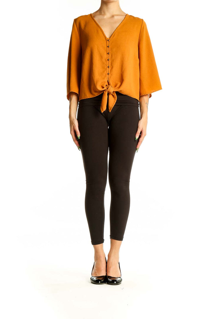 Front view of Urban Romantics mustard button-front blouse with tie-waist