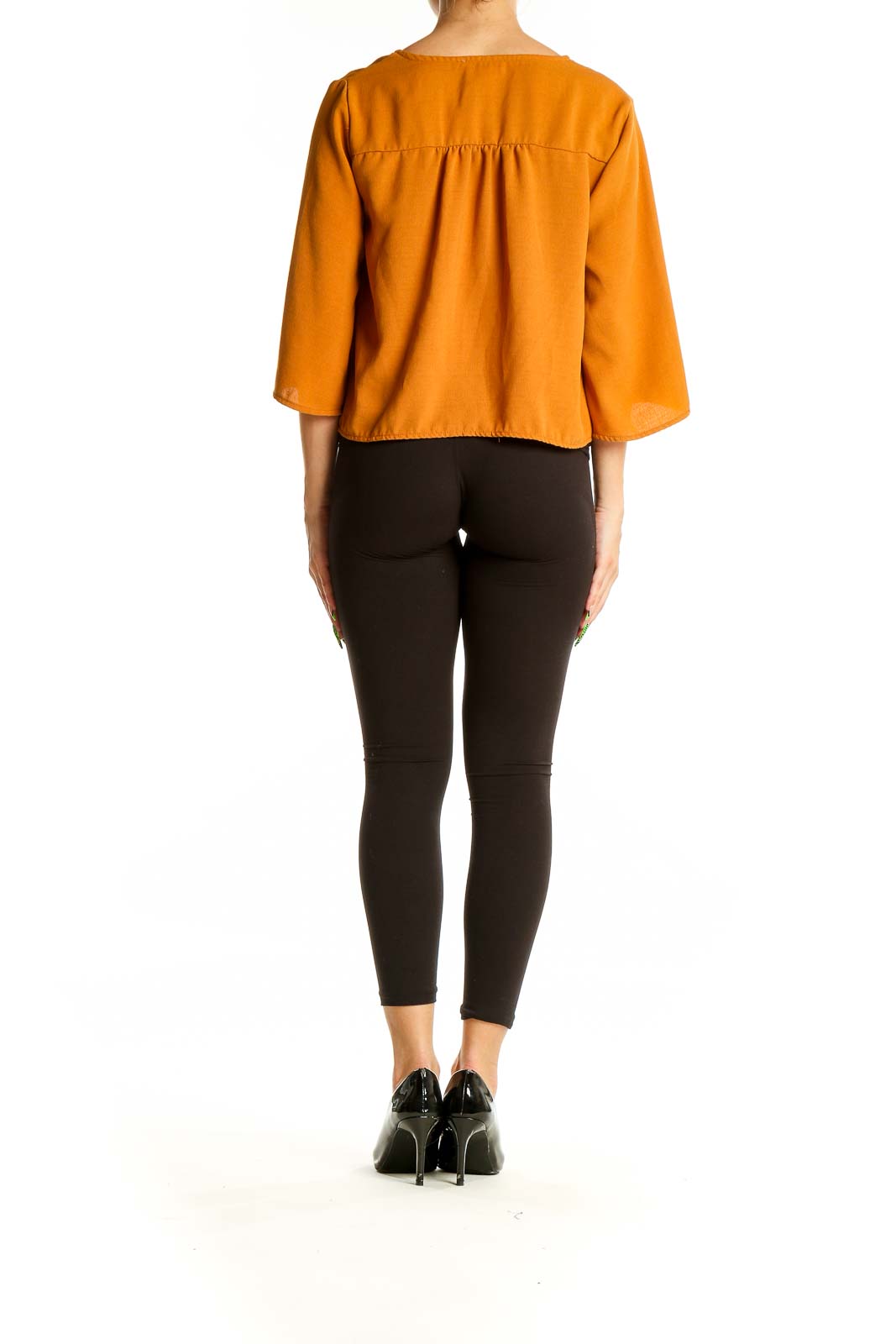 Back view of Urban Romantics mustard blouse showing relaxed fit and three-quarter sleeves