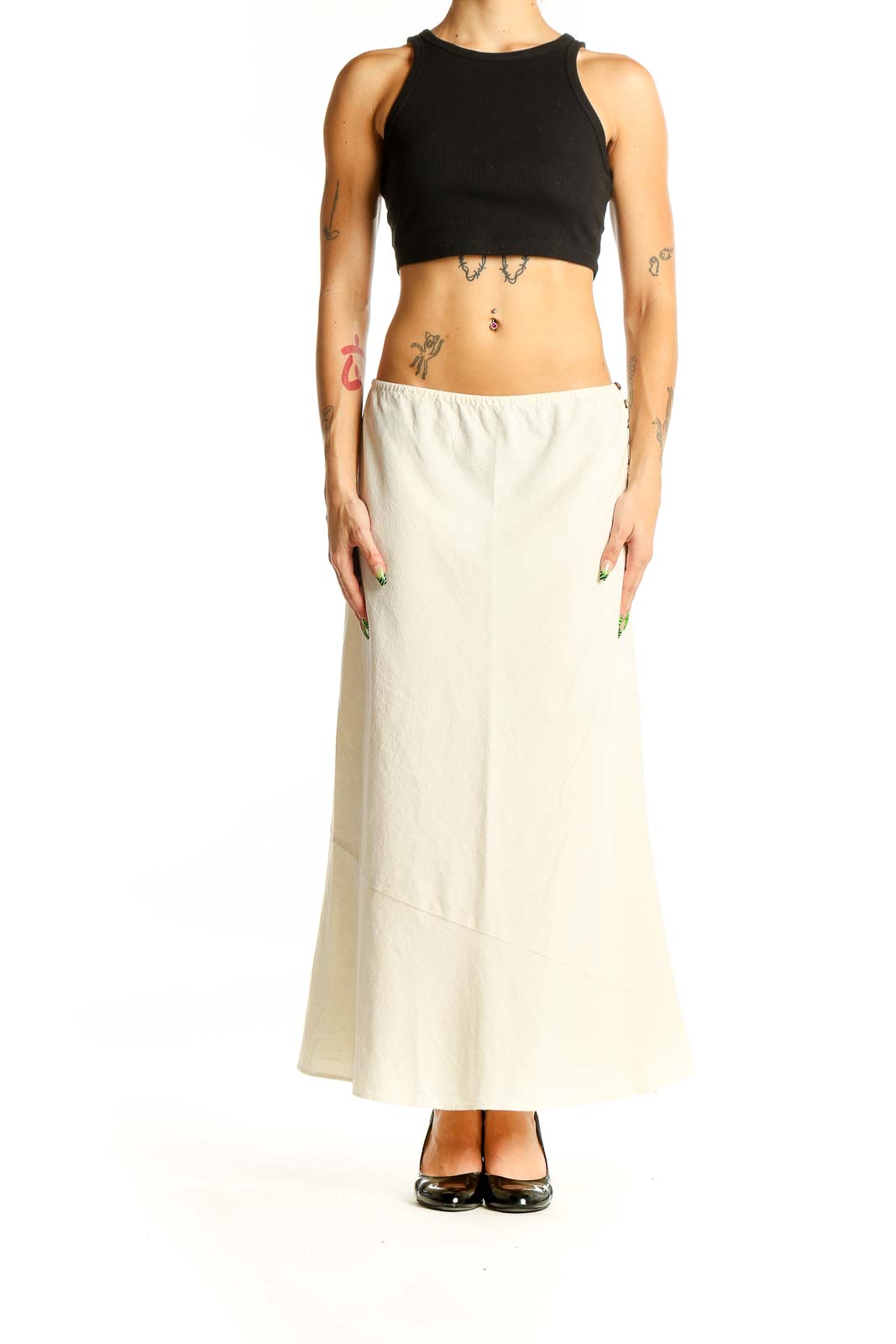 Front view of Free People cream cotton maxi skirt with A-line silhouette