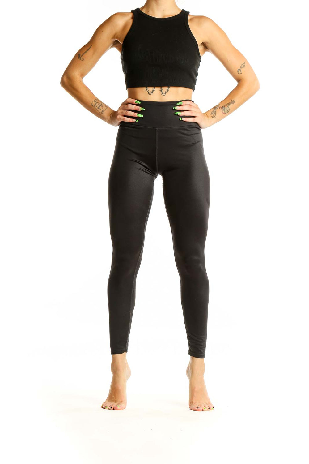 Front view of black high-waisted SOULCYCLE leggings on model