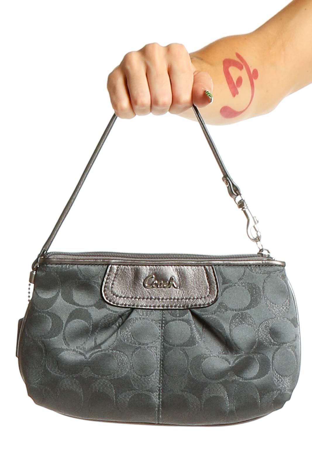 Front view of gray Coach wristlet clutch with signature canvas pattern