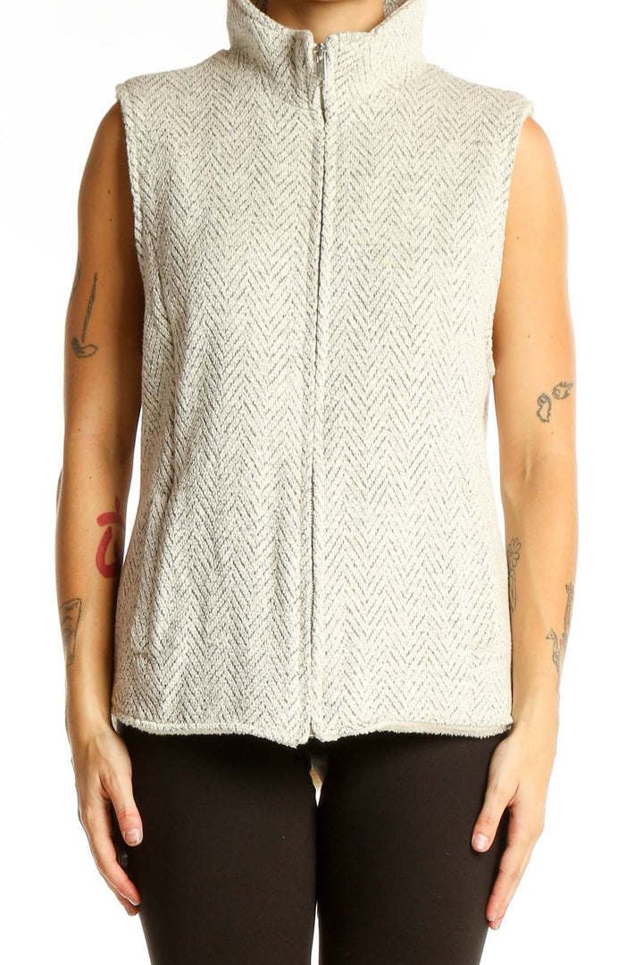 Front view of cream herringbone textured zip-up vest from altar'd state