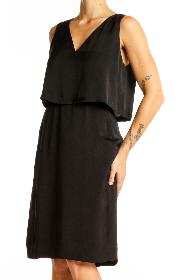 Front view of Madewell black V-neck sleeveless midi dress with overlay bodice