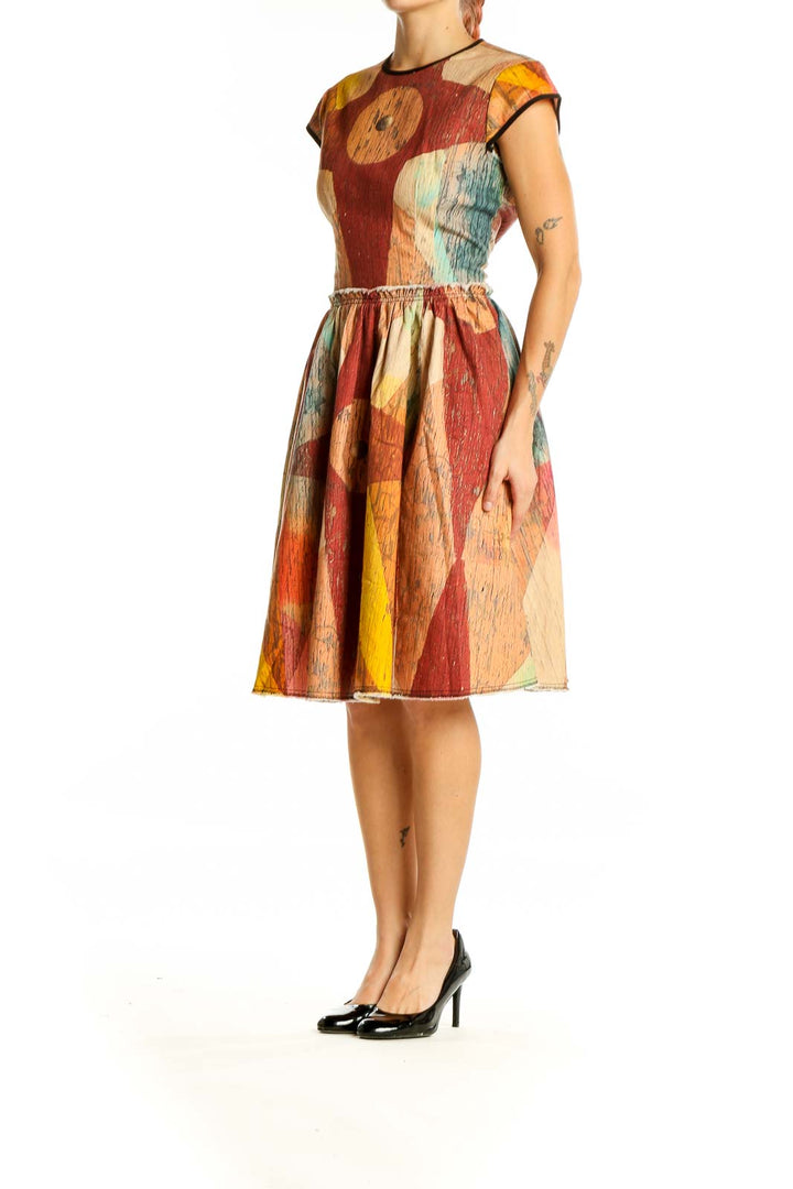 Front view of multicolor geometric print fit-and-flare dress by Making the Cut