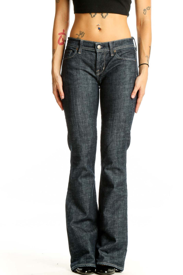 Front view of Citizens of Humanity dark blue flared jeans on model