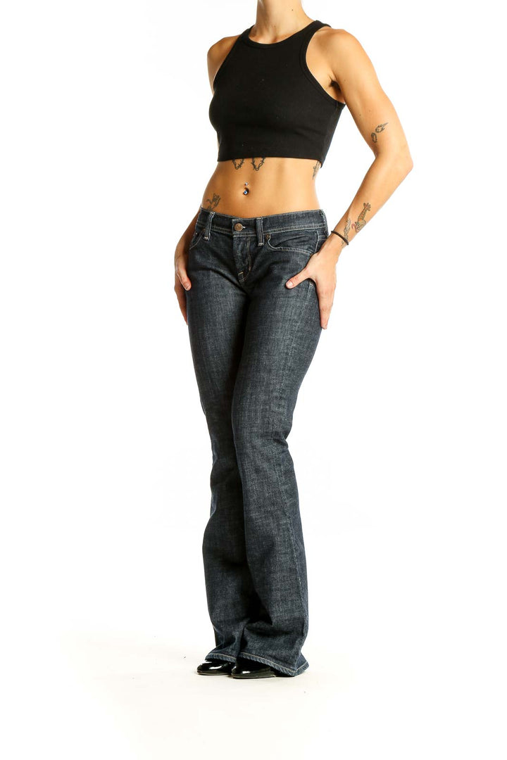 Front view of Citizens of Humanity dark blue flared jeans on model