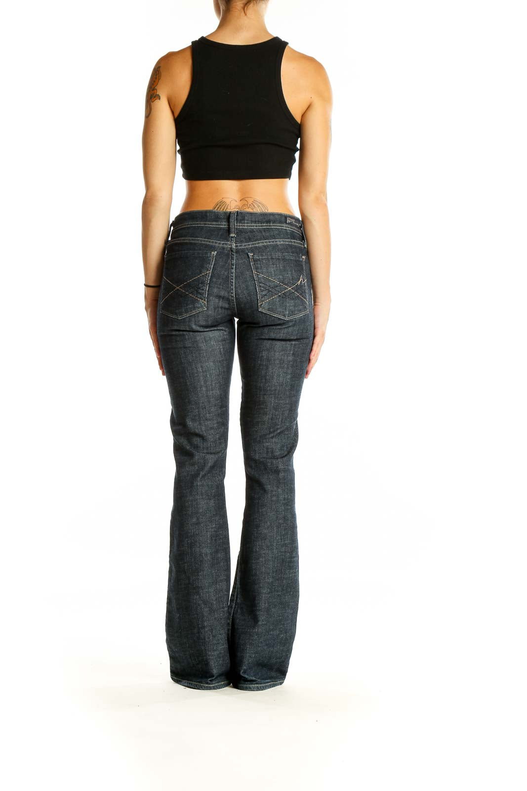 Back view of Citizens of Humanity dark blue flared jeans on model