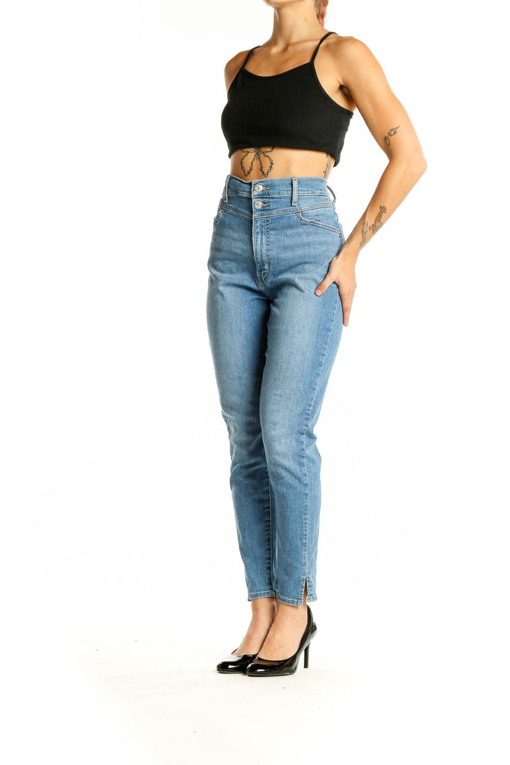 Front view of Levi's light blue high-waisted slim fit jeans on model