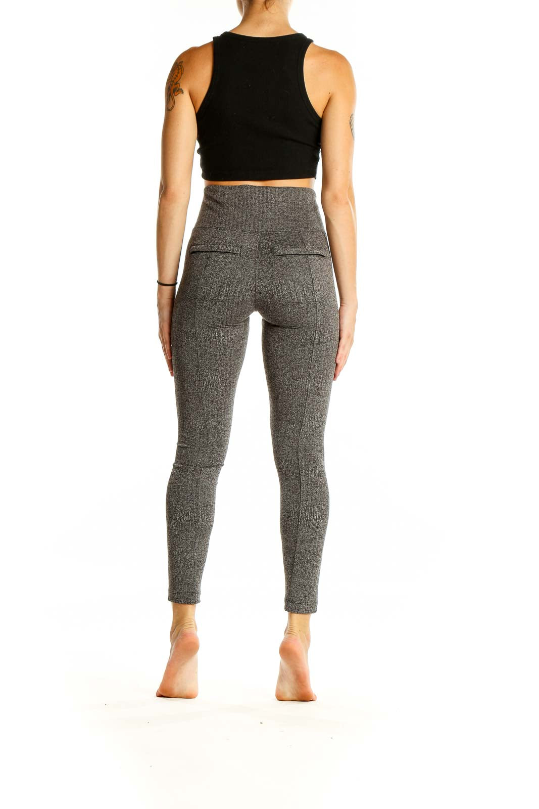 Back view of Athleta gray high-waisted performance leggings showing fit and design