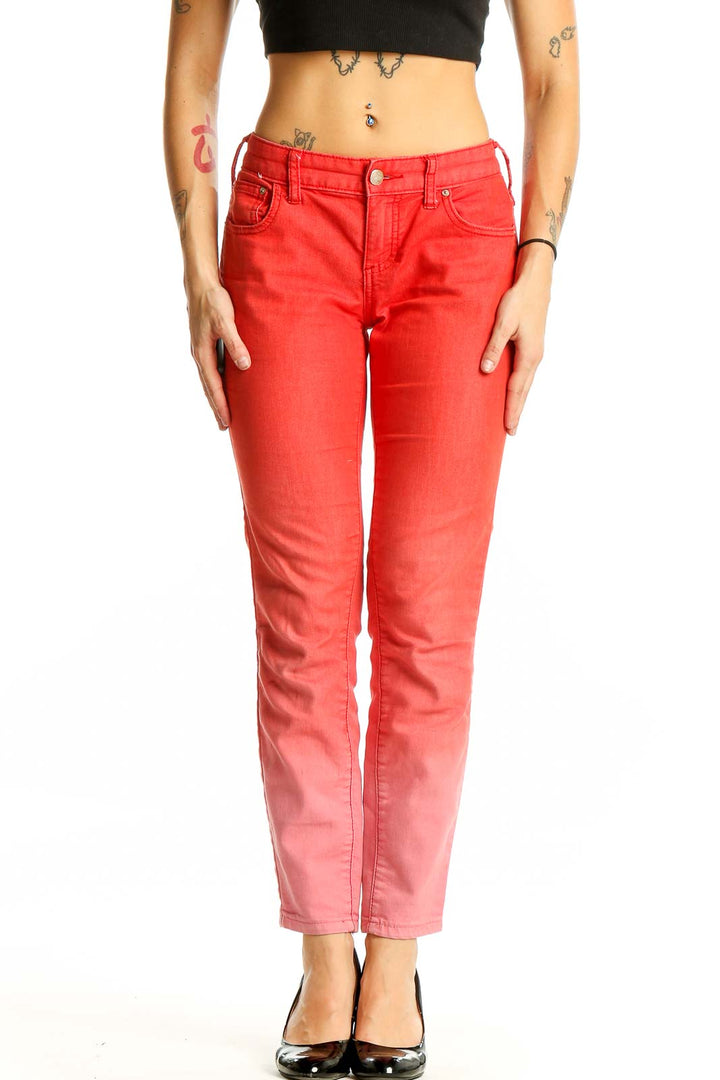 Front view of Free People red ombre skinny jeans with gradient effect