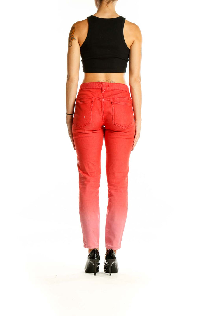 Back view of Free People red ombre skinny jeans showing gradient and fit