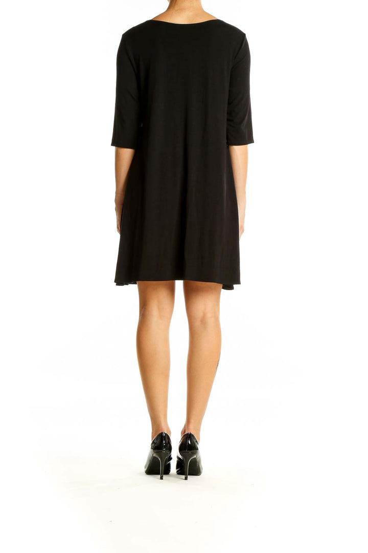 Back view of Eileen Fisher black V-neck flowy midi dress