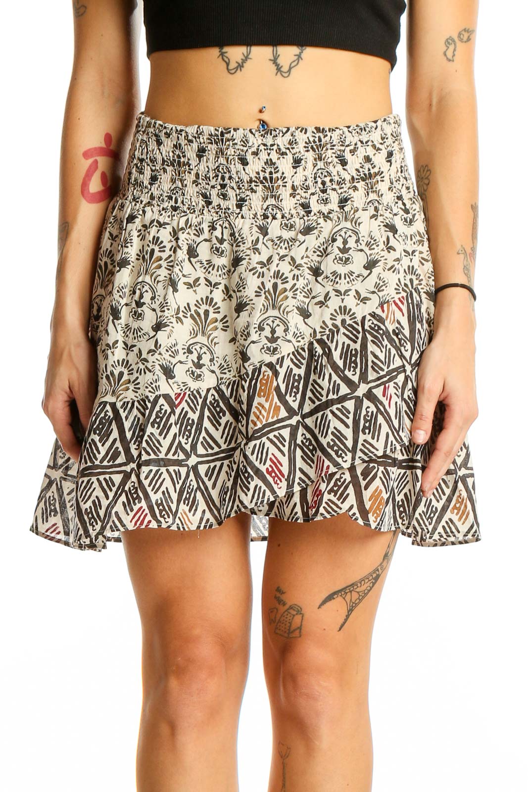 Front view of cream floral print mini skirt with smocked waistband