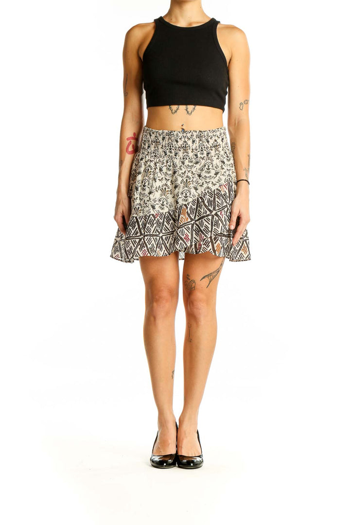 Front view of cream floral print mini skirt with smocked waistband