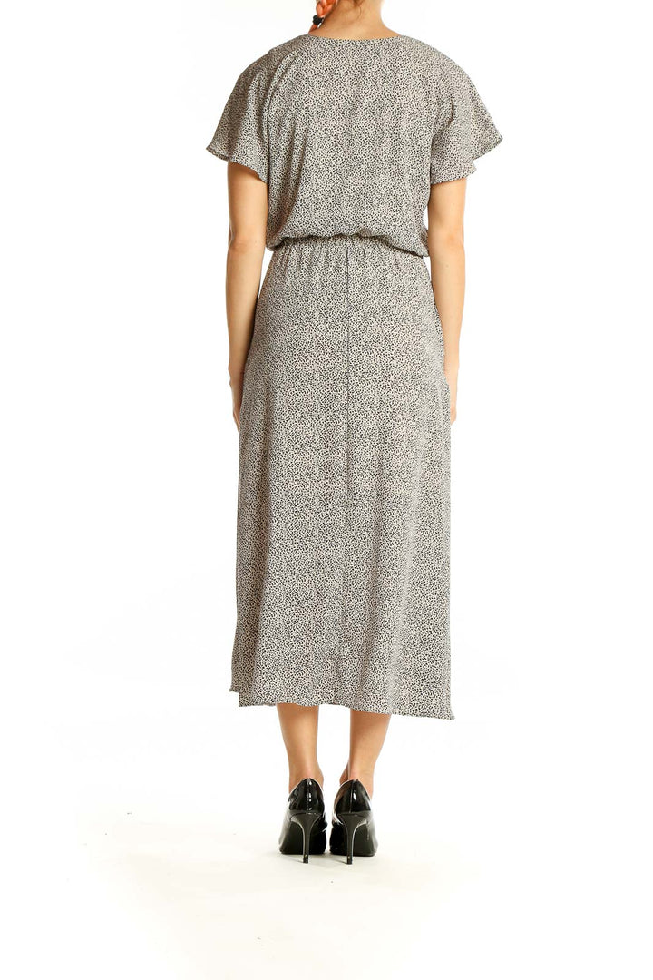 Back view of gray speckled SilkRoll midi dress showing fluttery short sleeves