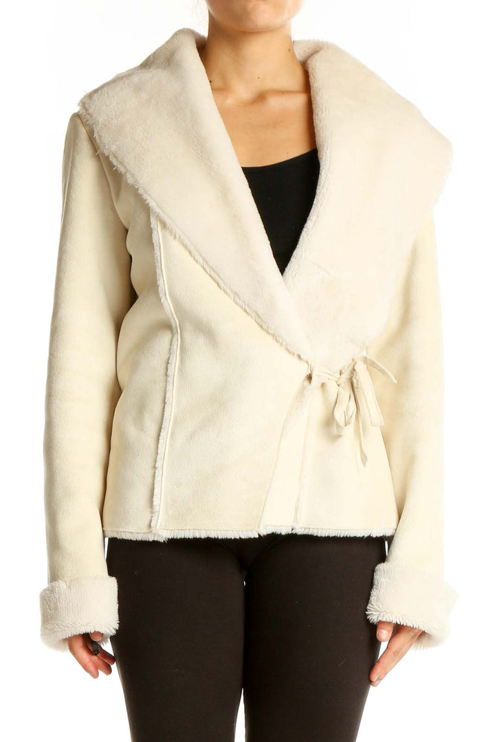 Front view of cream wrap jacket with faux fur collar from White House Black Market