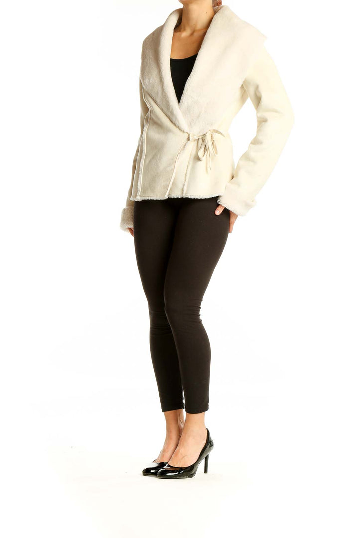 Front view of cream wrap jacket with faux fur collar from White House Black Market