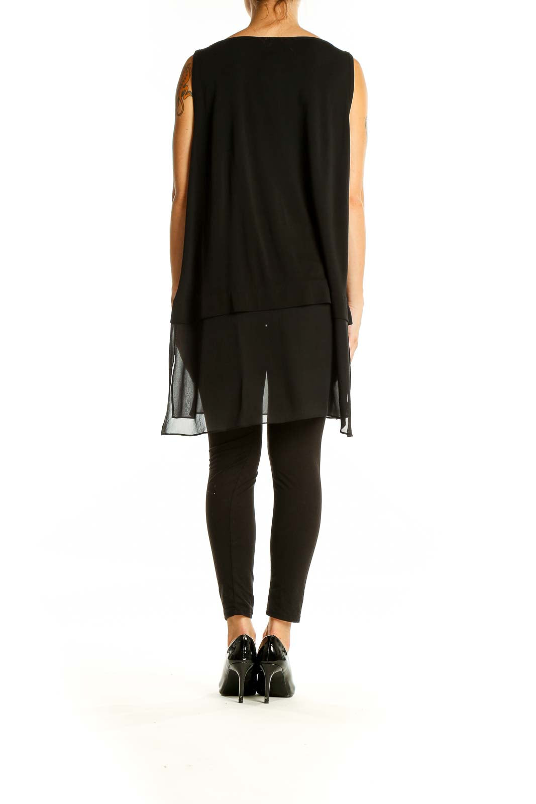 Back view of Eileen Fisher black silk sleeveless tunic showing full length and sheer bottom panel