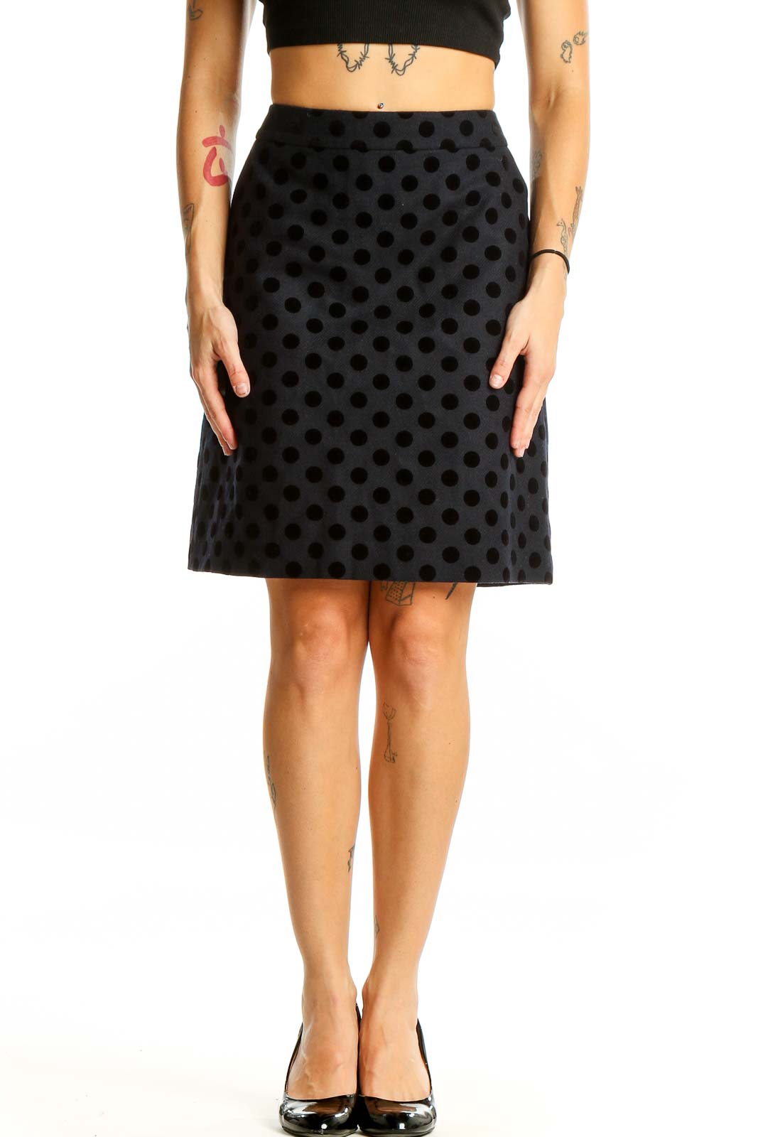 Front view of Boden black polka dot A-line knee-length skirt