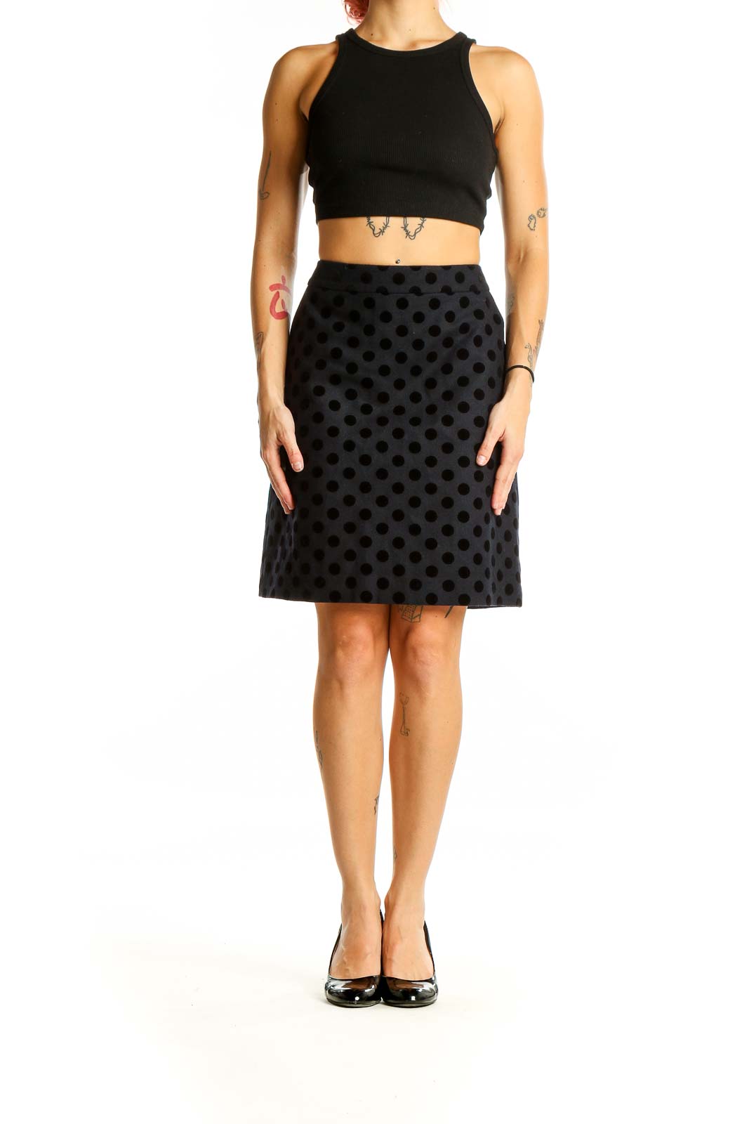 Front view of Boden black polka dot A-line knee-length skirt