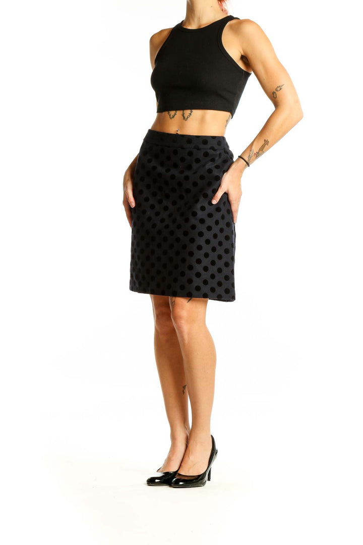 Front view of Boden black polka dot A-line knee-length skirt