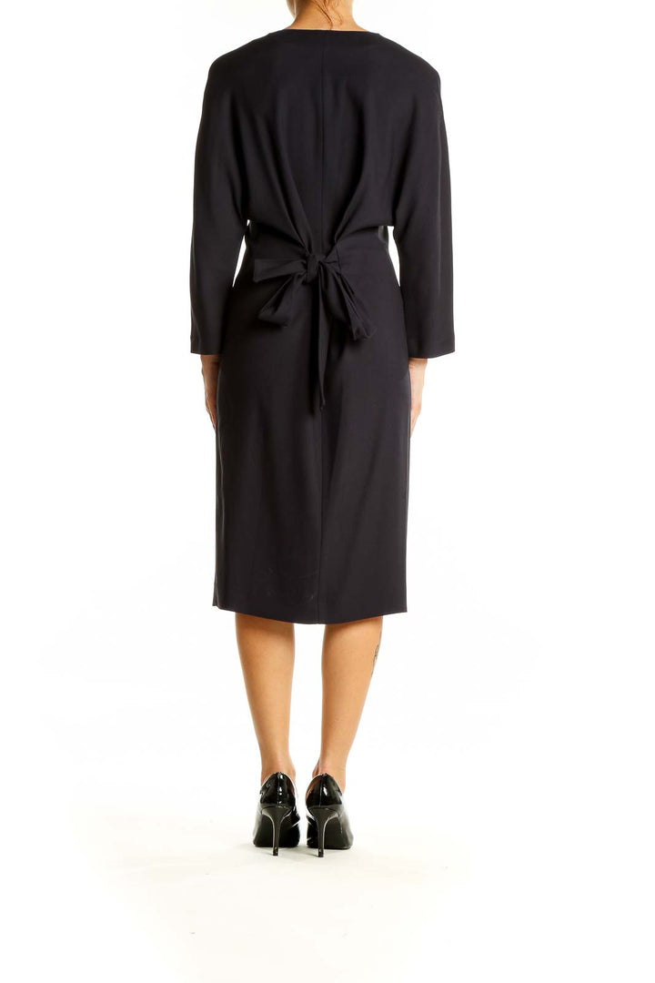 Back view of Massimo Dutti black midi dress with tie-back detail