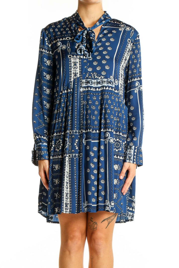 Front view of Zara blue patterned boho-chic mini dress with tie-neck