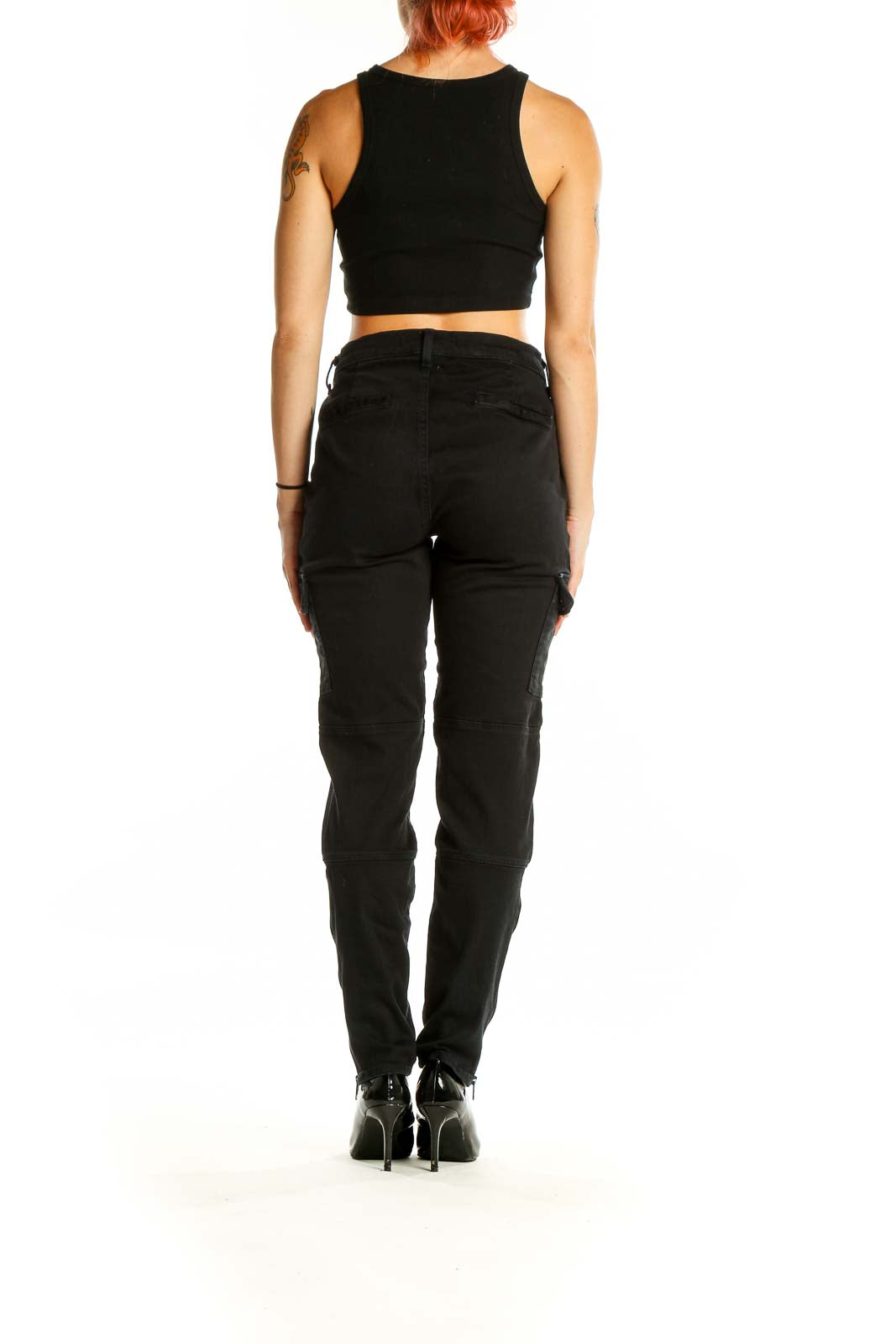 Back view of black J Brand cargo denim jeans on model