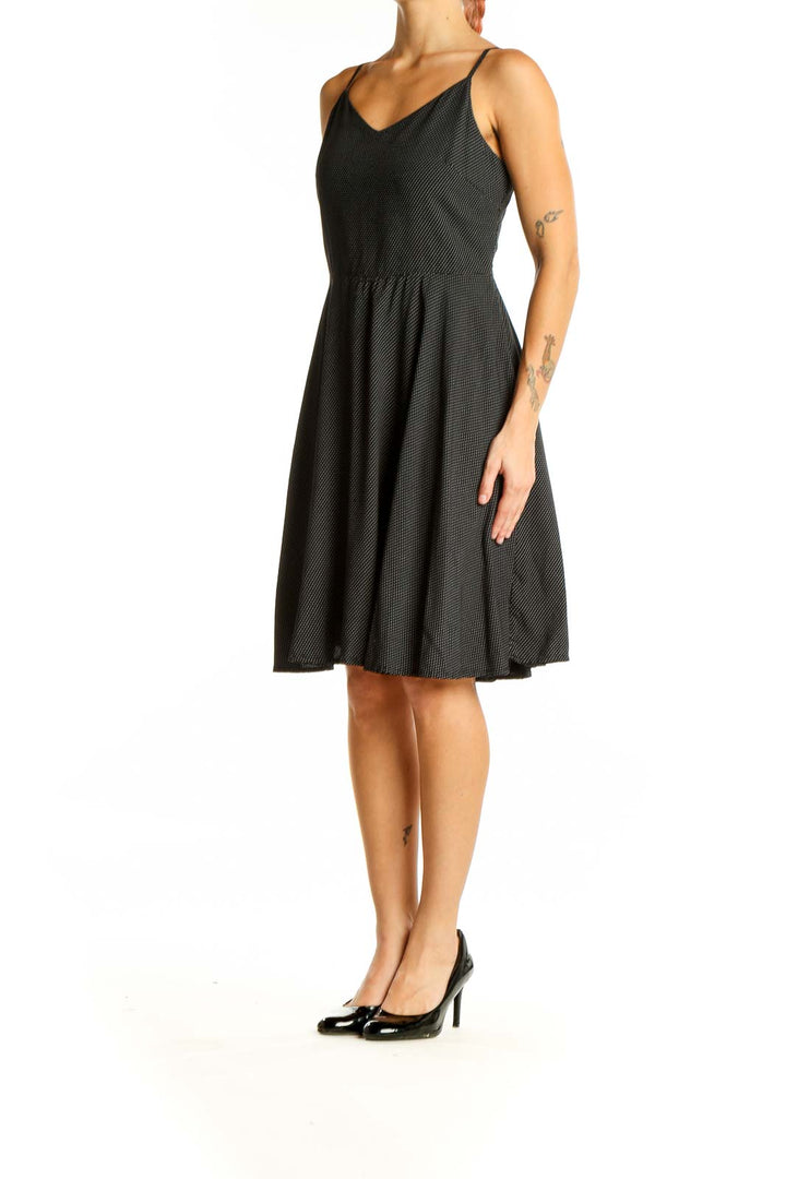 Front view of Gap black polka dot sundress with V-neckline and thin straps