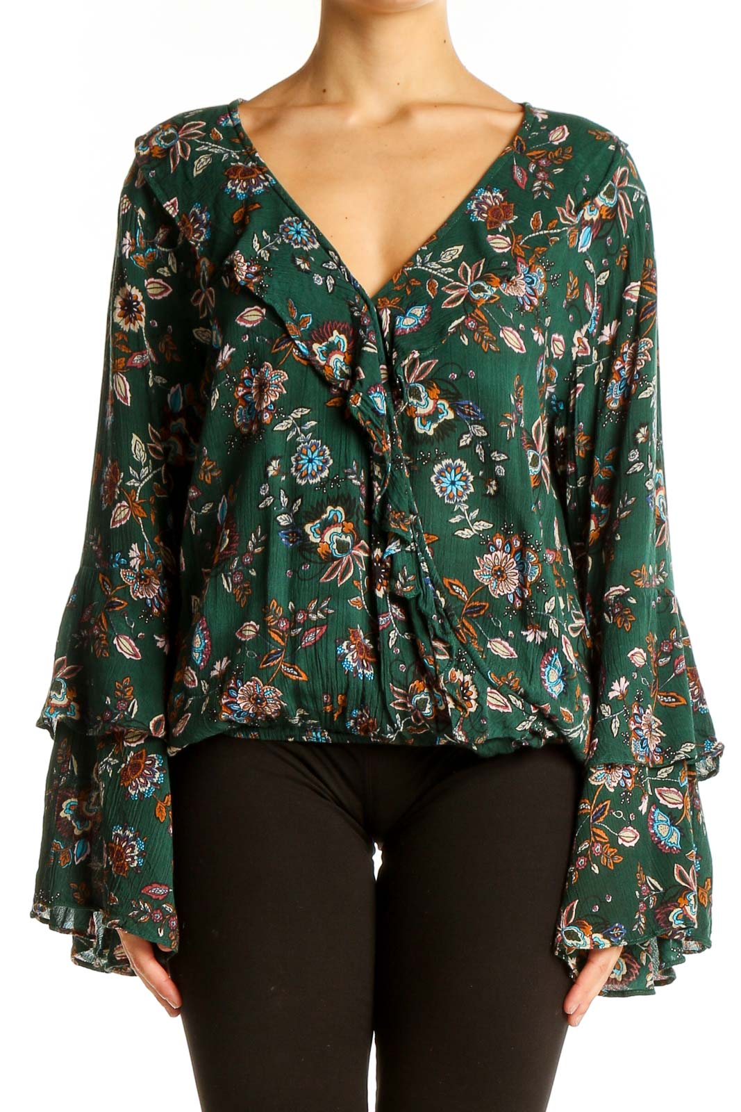 Front view of Chelsea & Violet green floral wrap top with bell sleeves