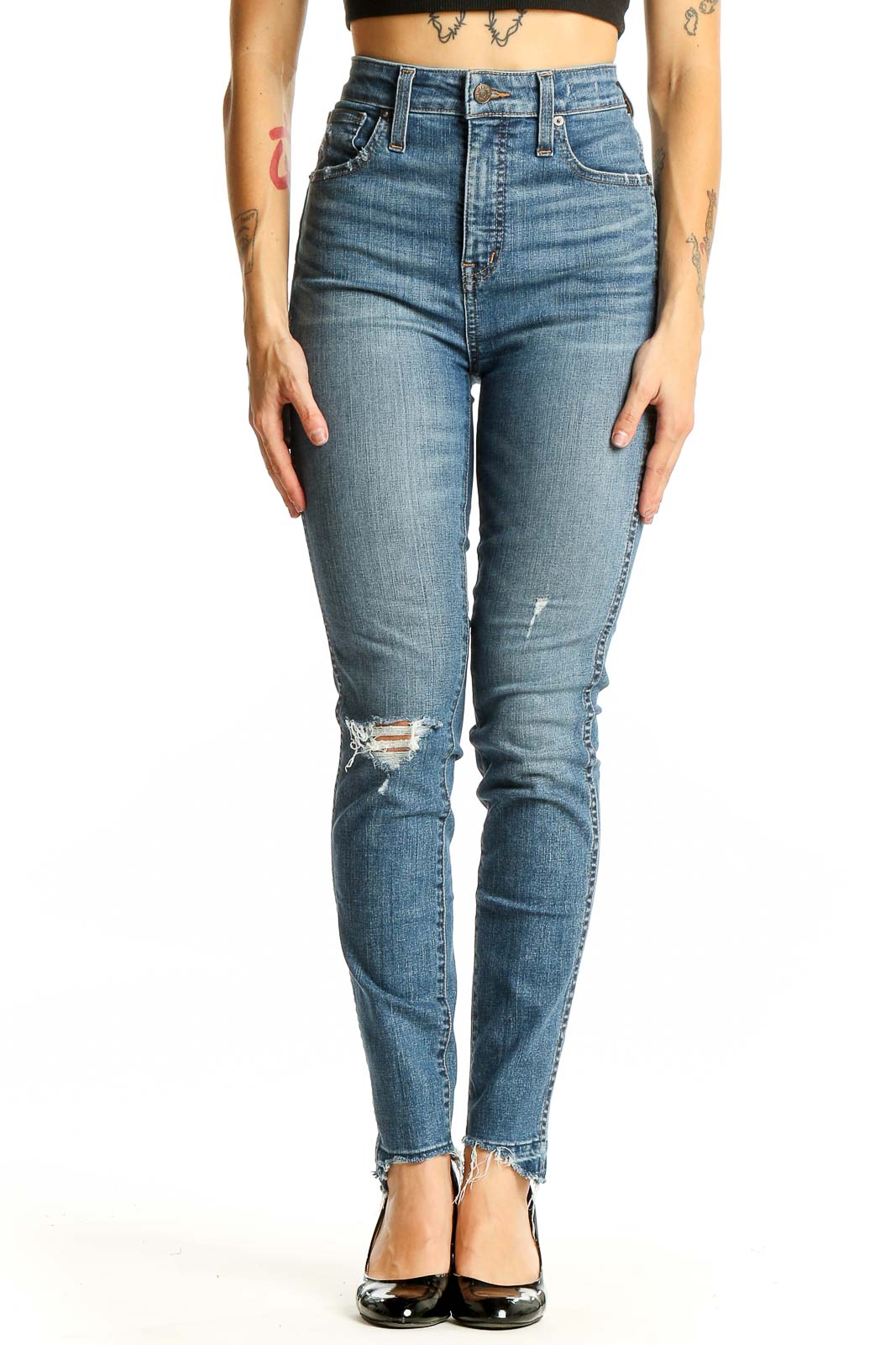 Front view of Madewell blue high-rise skinny jeans with distressed knee