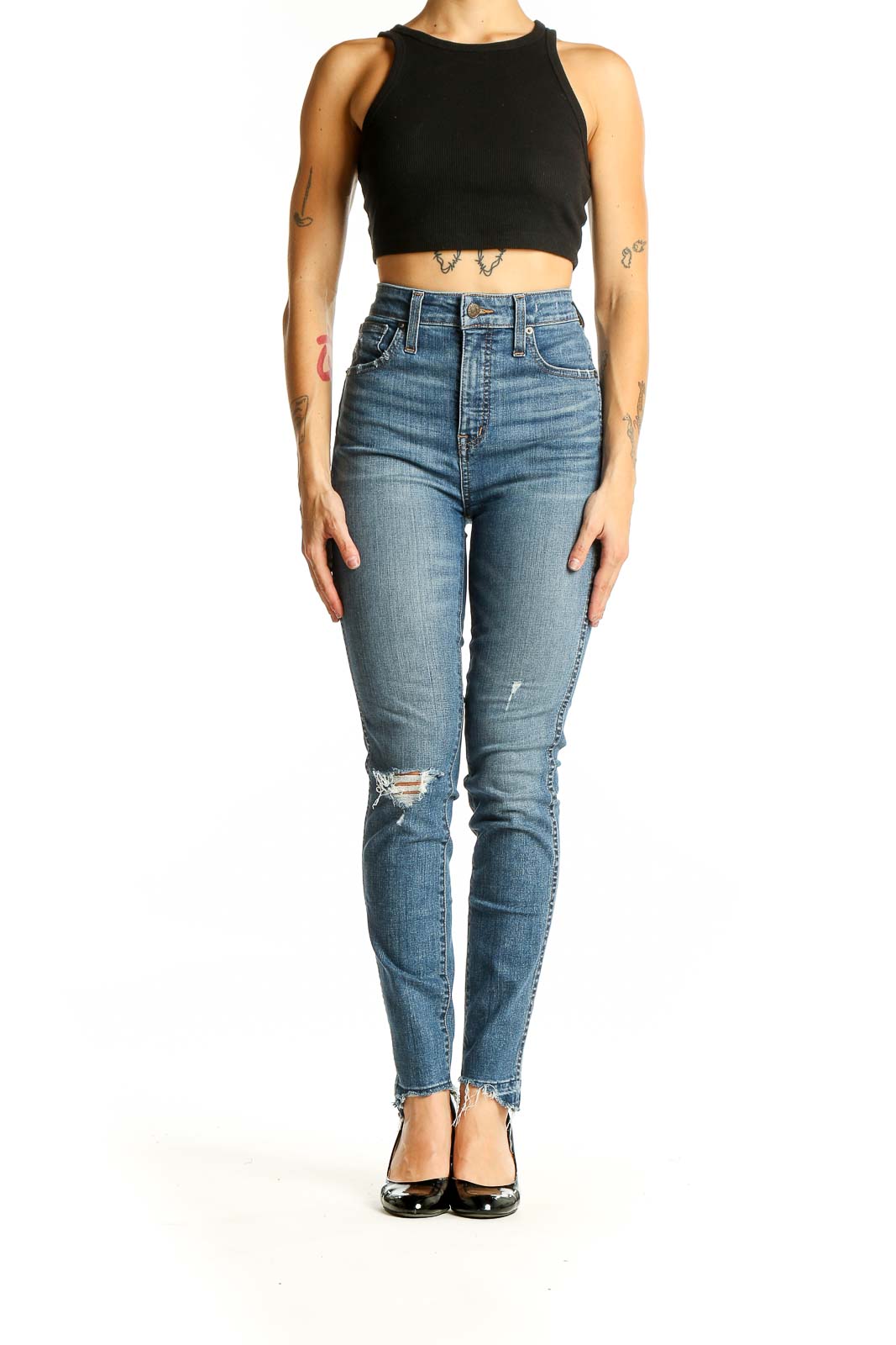 Front view of Madewell blue high-rise skinny jeans with distressed knee