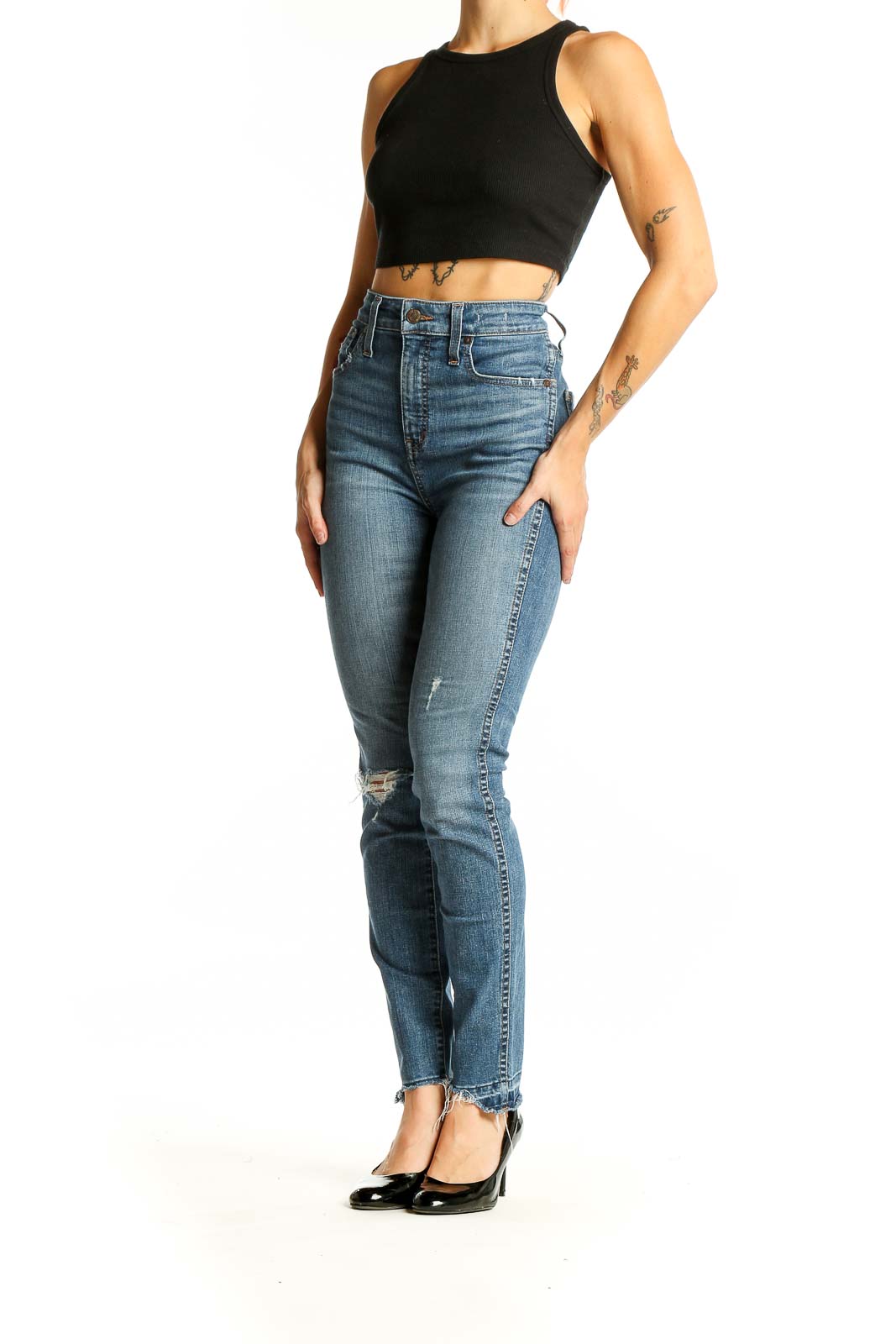 Front view of Madewell blue high-rise skinny jeans with distressed knee