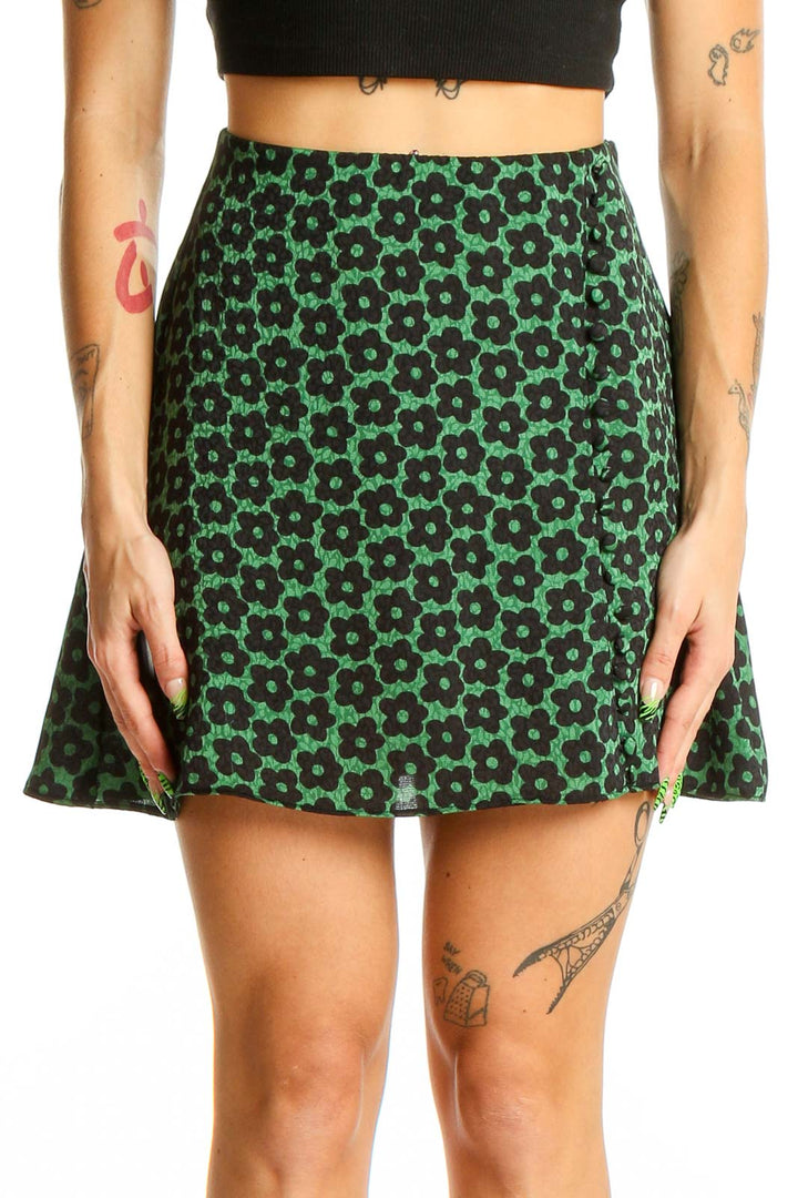 Front view of Urban Outfitters green floral print mini skirt