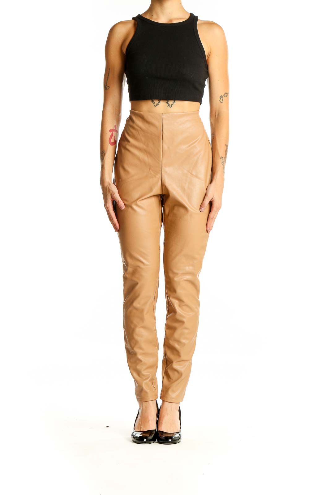 Front view of tan high-waisted faux leather pants from Express