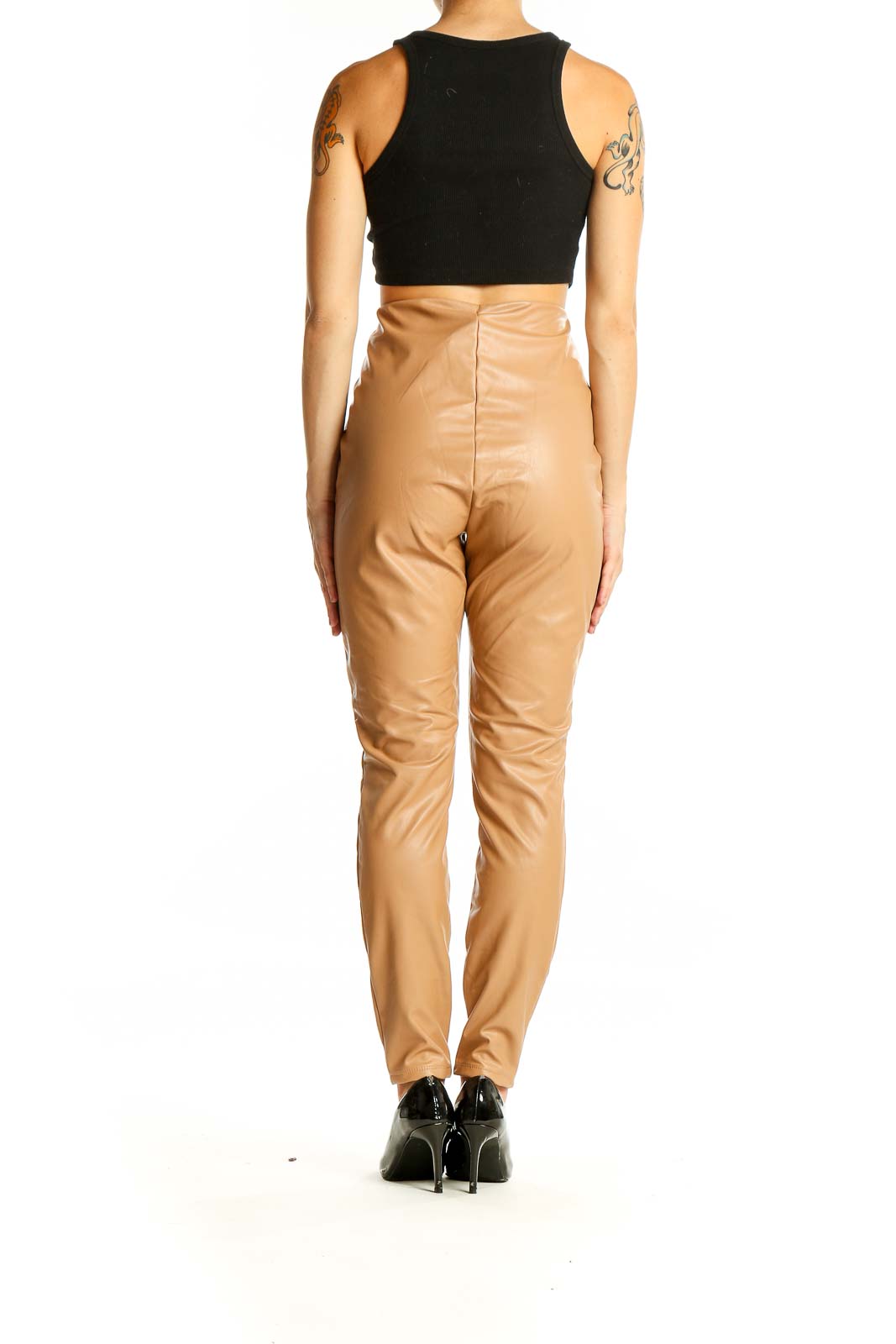 Back view of tan high-waisted faux leather pants from Express