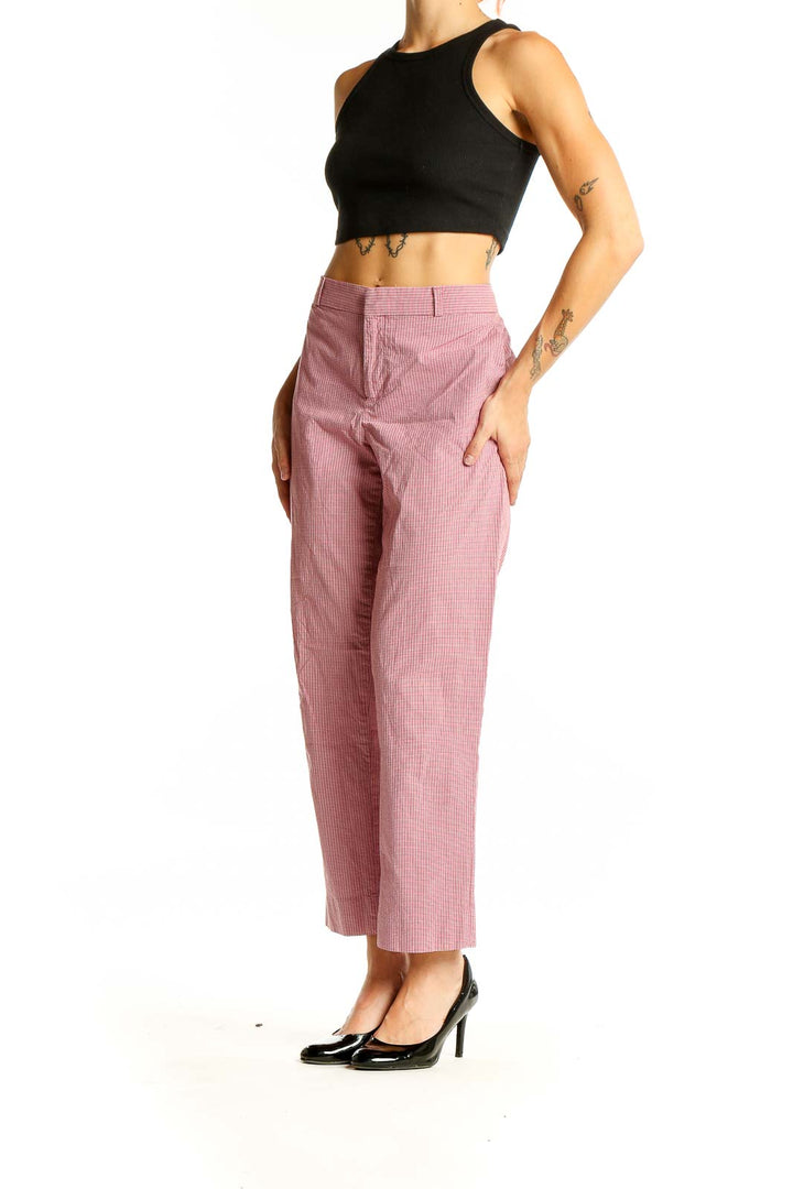 Front view of Avery pink striped cropped pants on model