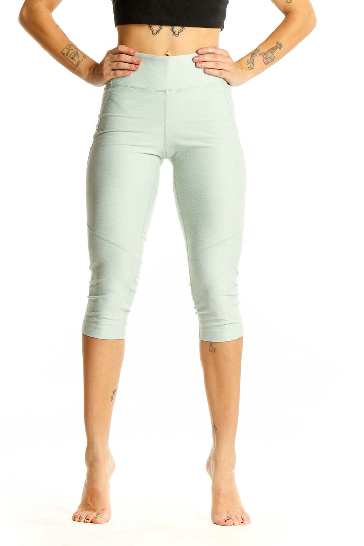 Front view of mint green high-waisted capri leggings from Outdoor Voices