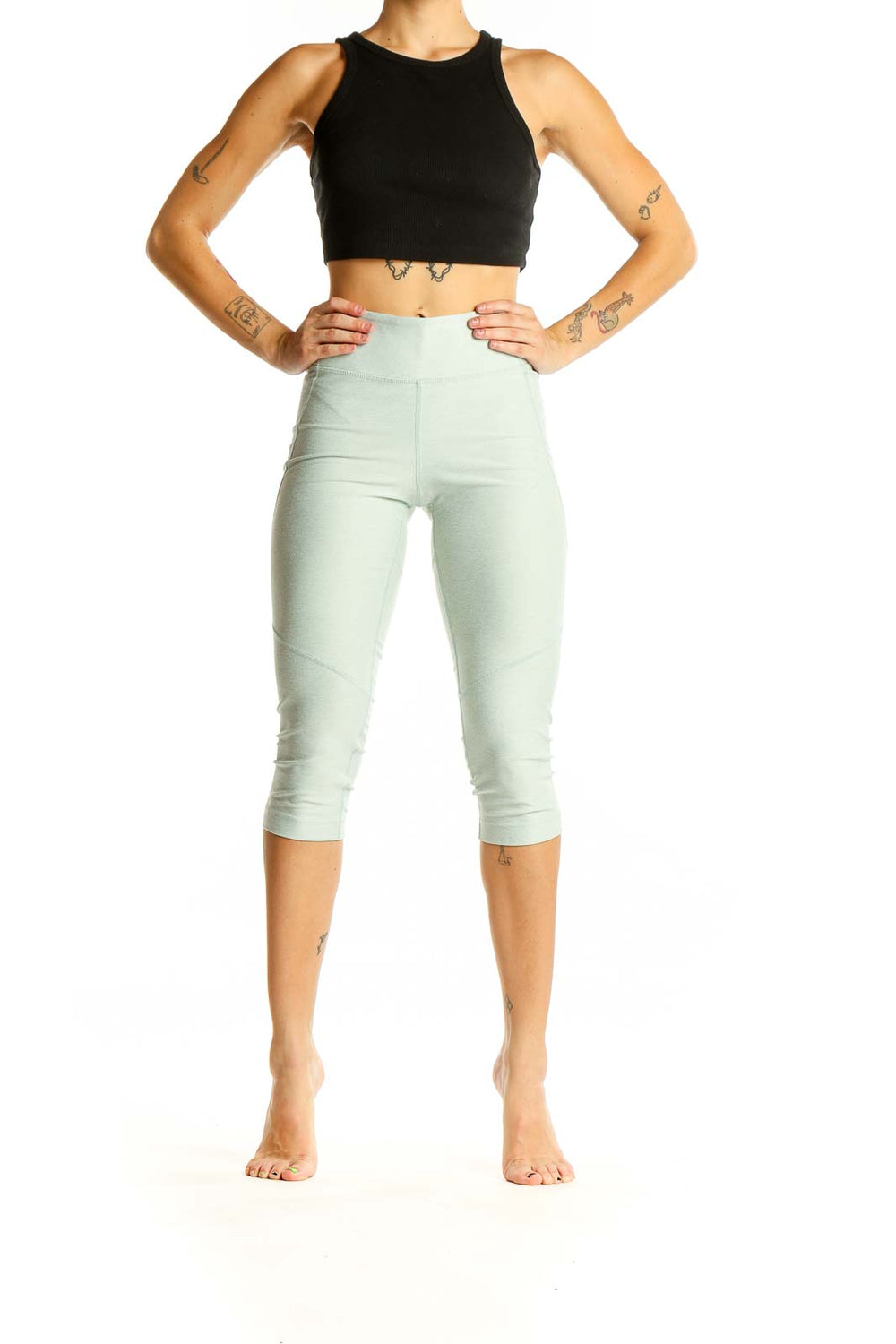 Front view of mint green high-waisted capri leggings from Outdoor Voices