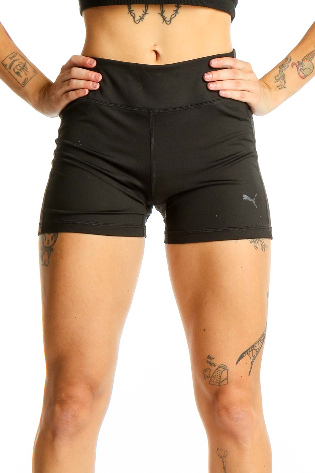 Front view of black Puma high-waisted athletic shorts