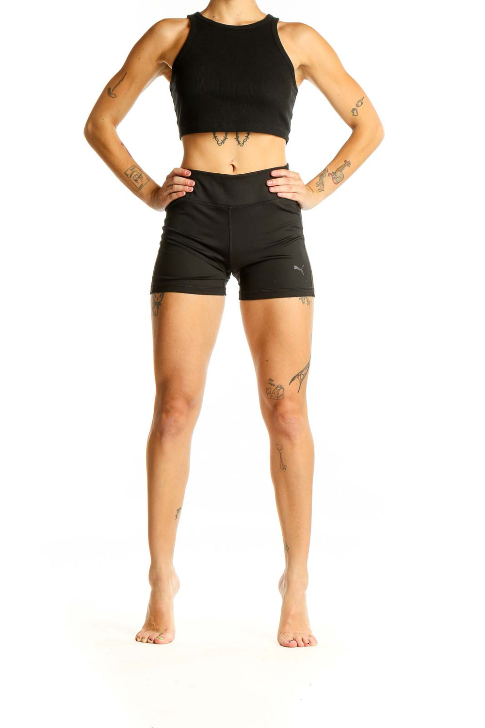 Front view of black Puma high-waisted athletic shorts