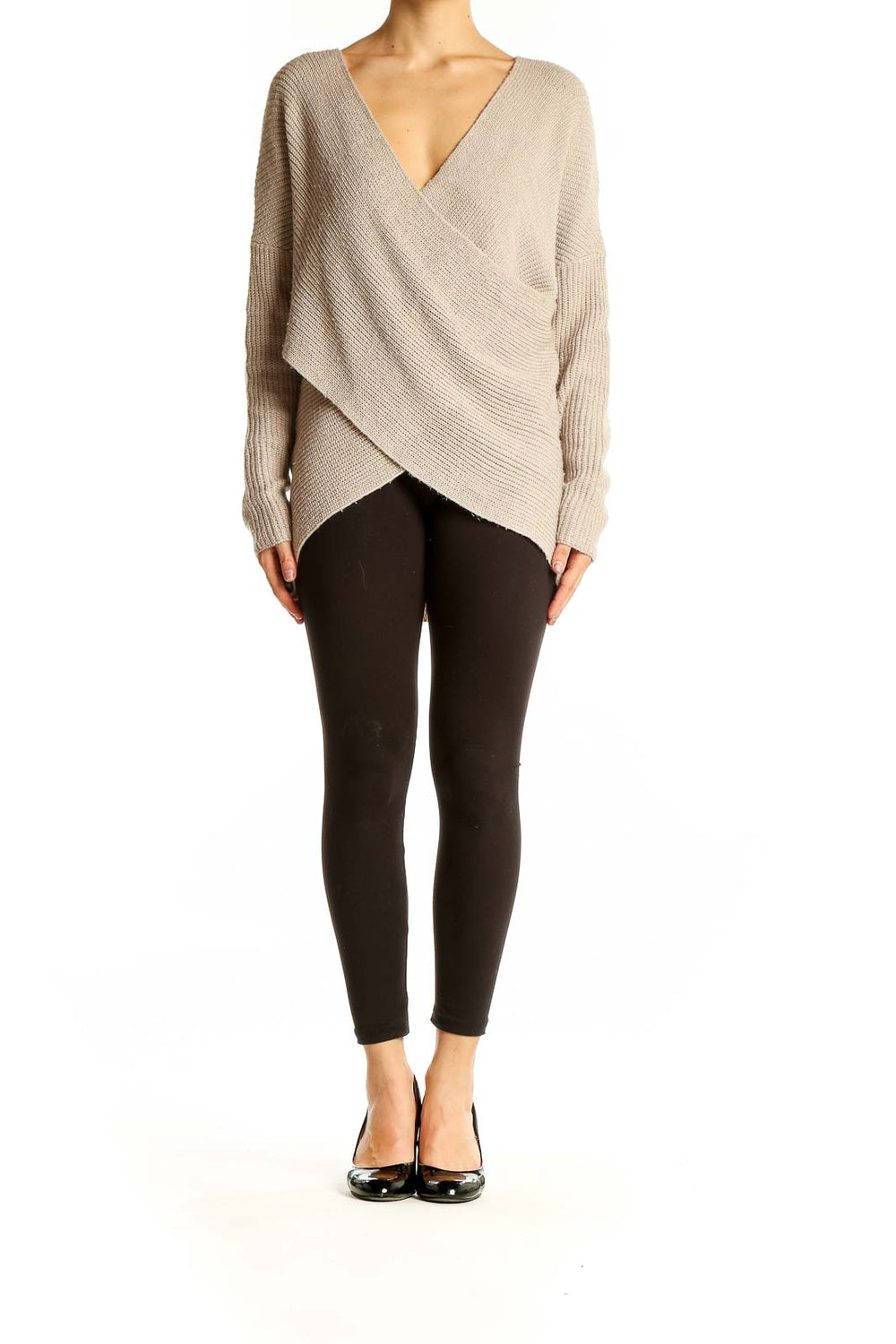 Front view of beige ASTR wrap-style oversized knit sweater with V-neckline