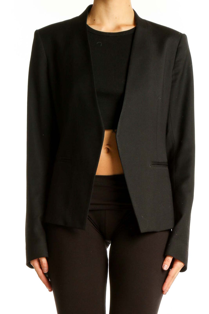 Front view of black Theory open-front blazer on model