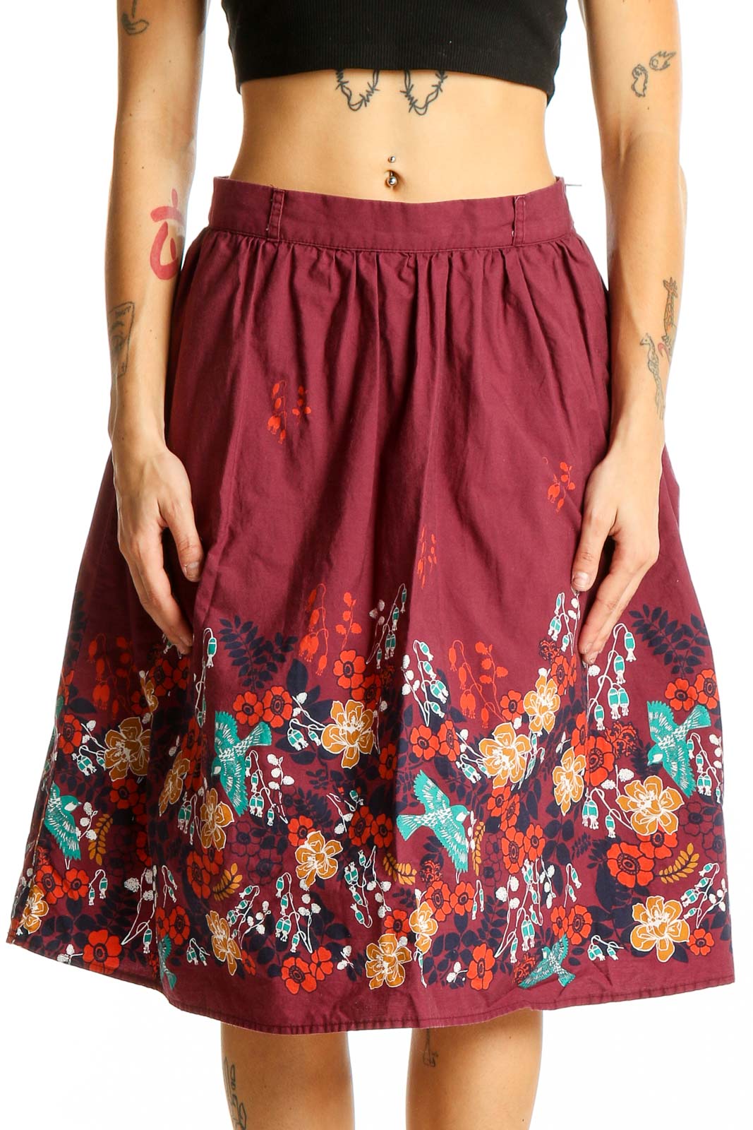 Front view of burgundy ModCloth cotton skirt with colorful floral print along hem