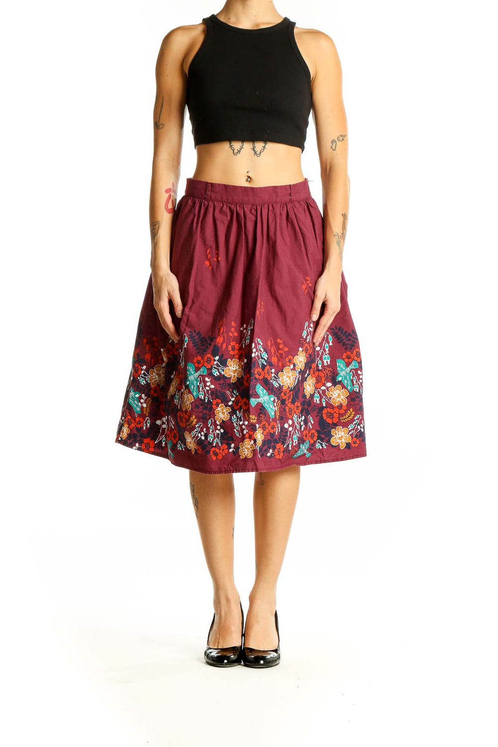 Front view of burgundy ModCloth cotton skirt with colorful floral print along hem