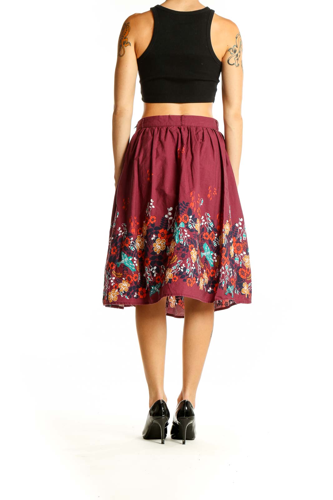 Side view of burgundy ModCloth cotton skirt showing floral print and flowy silhouette