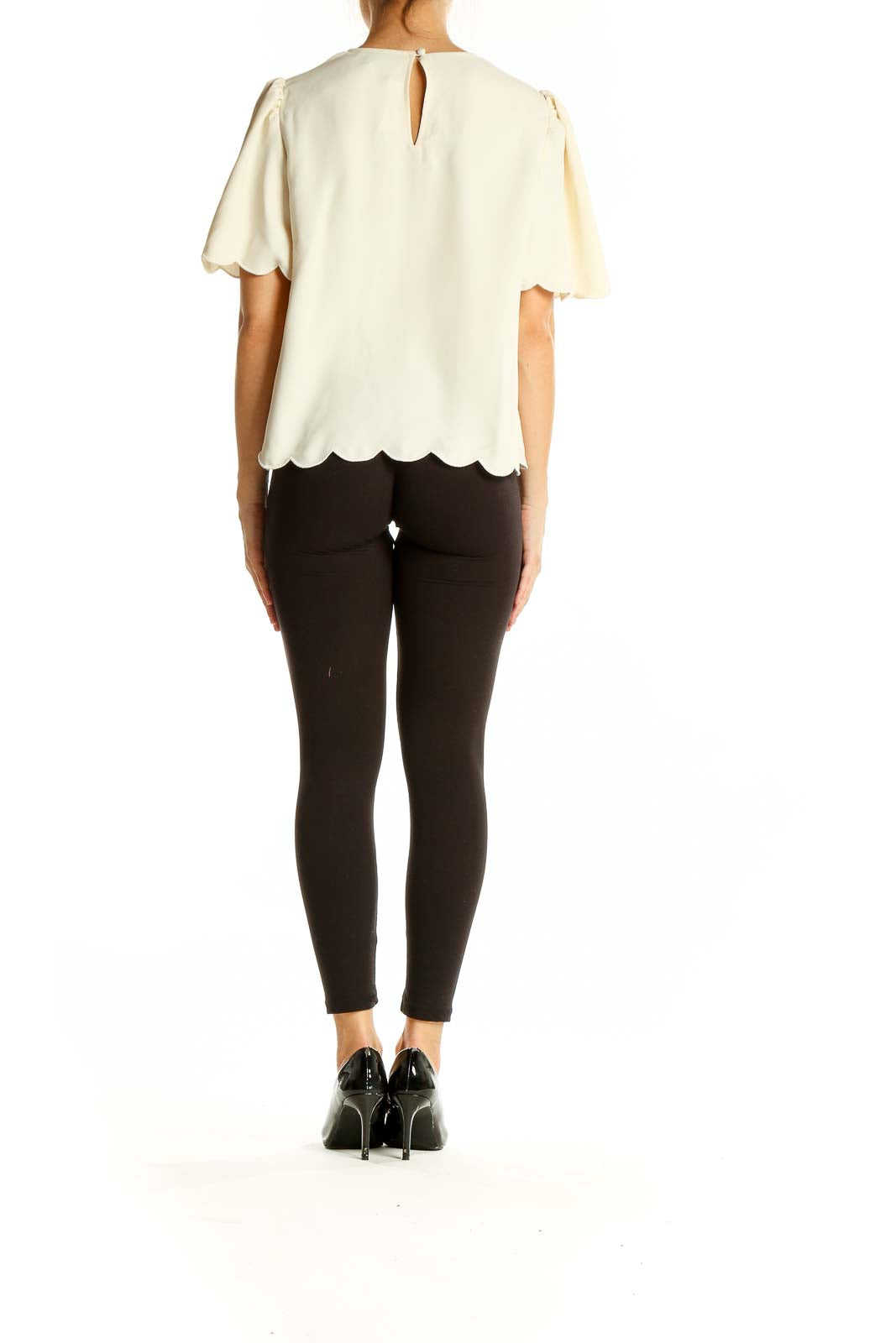 Back view of Express cream blouse showing scalloped hem and relaxed fit