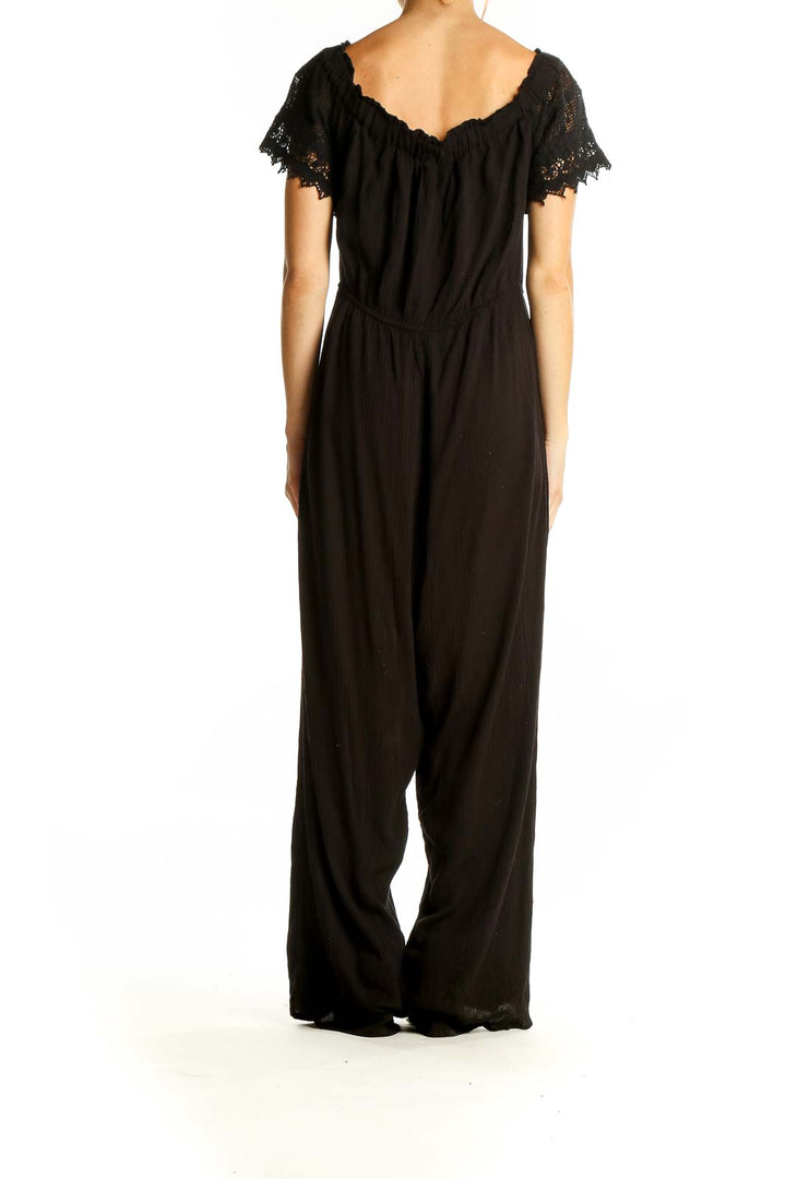 Back view of Blush black off-shoulder jumpsuit showing full-length design