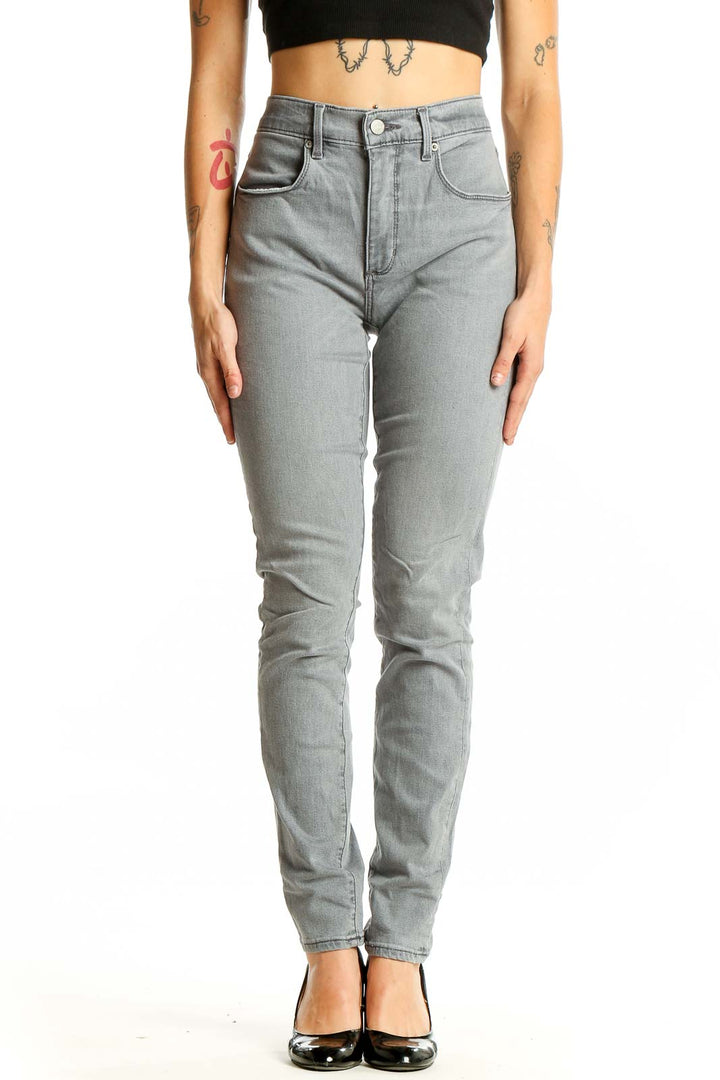 Front view of LOFT gray high-waisted skinny jeans on model